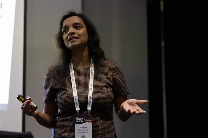 Adhithi Ravichandran speaking at a Google-sponsored conference